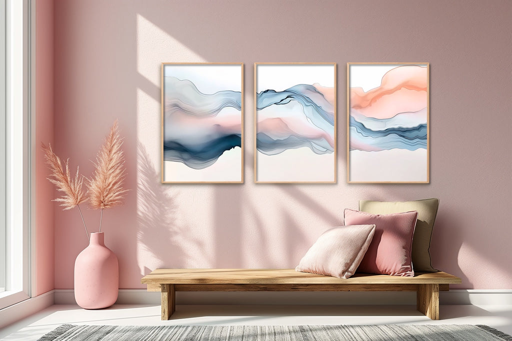 A three piece abstract fluid wall art set in blue and blush.