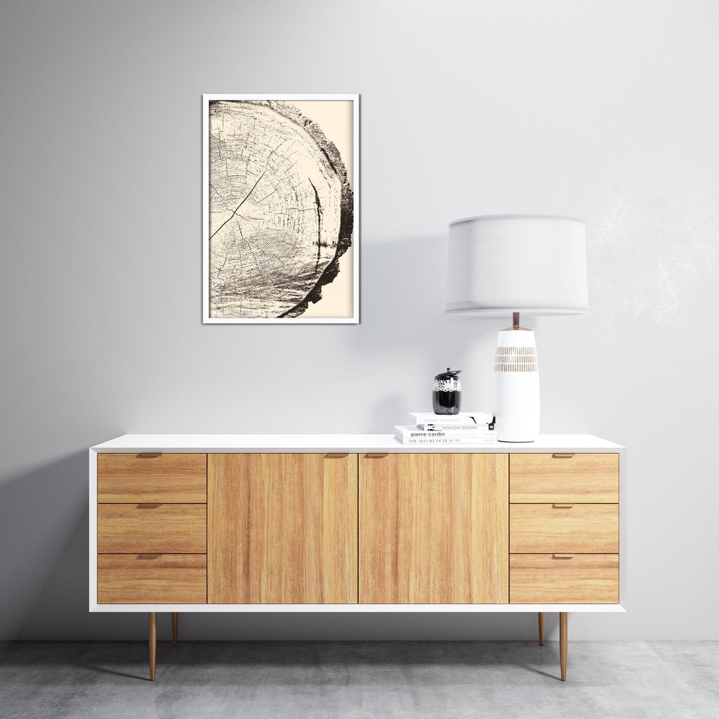 A simplistic tree rings art print in brown and cream. 