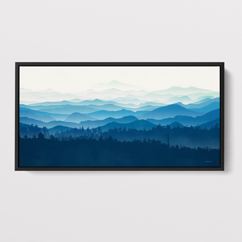 Large framed mountain landscape artwork in shades of blue.