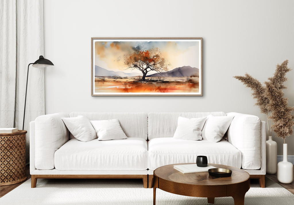 A large southwestern watercolor wall art featuring a lone tree.