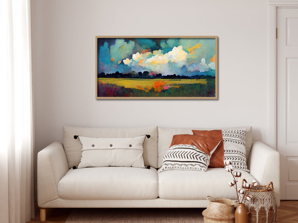 A large country landscape art print featuring big clouds over a flower field.