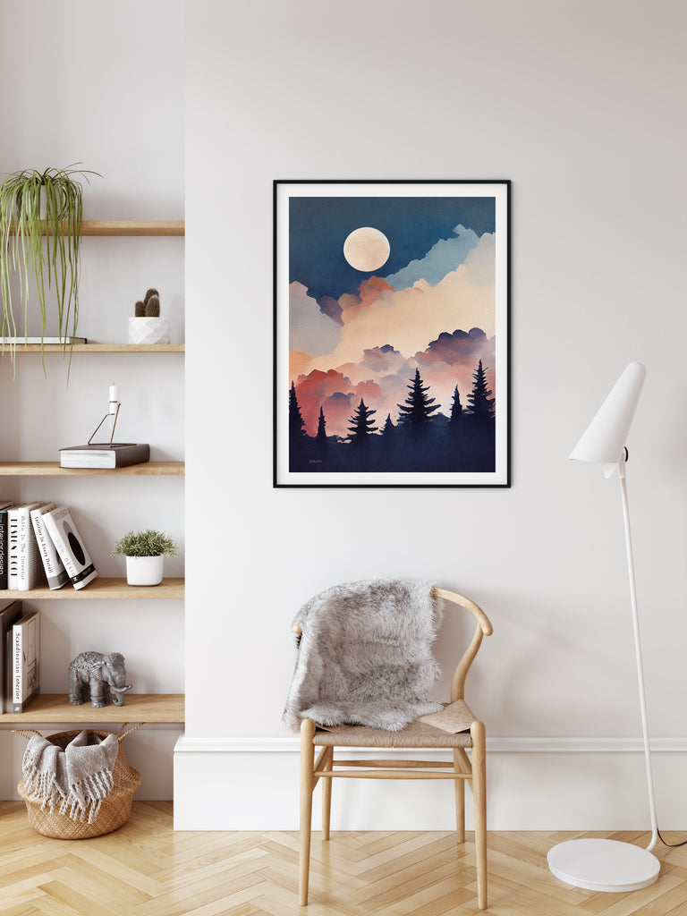 The moon rises above misty forest in this framed artwork. 