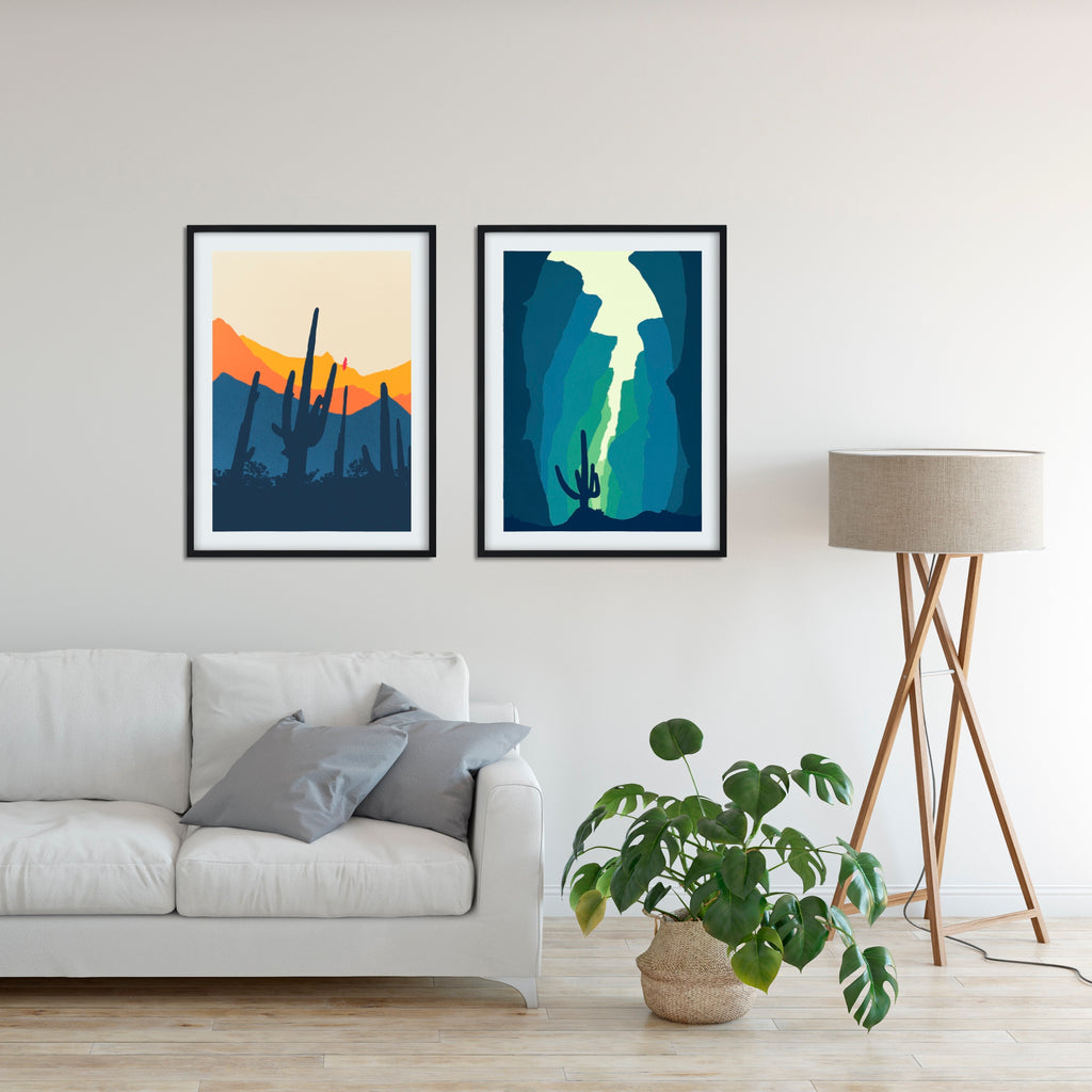 A set of two Southwestern desert canvas artworks in blue, green, and orange.